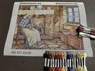 Starší paní šije